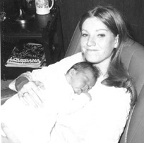 Mom with me as a newborn